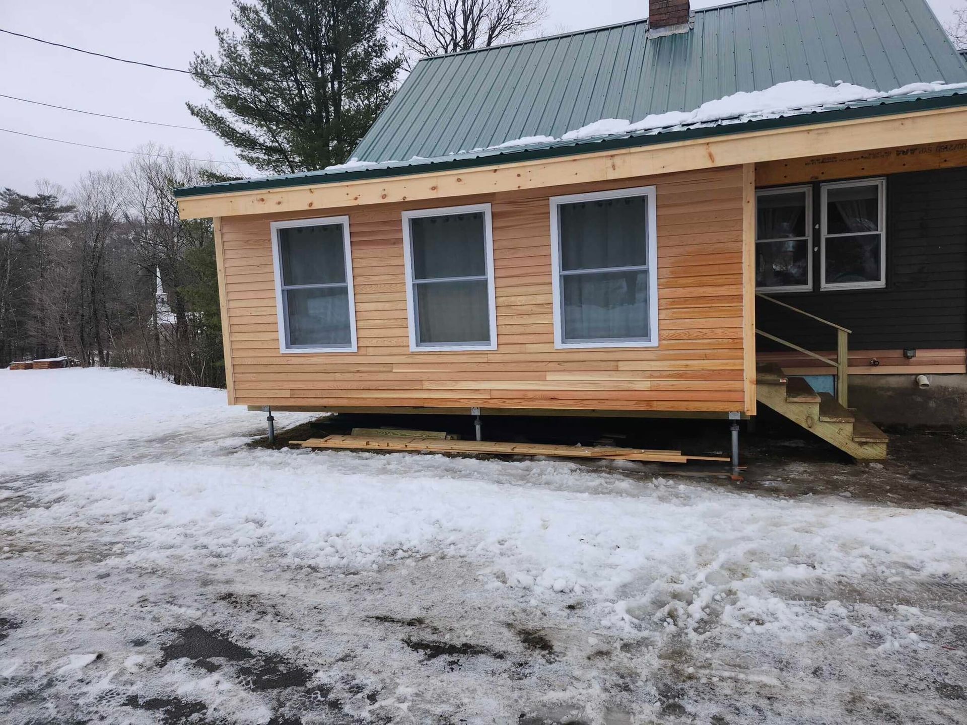A freshly constructed sun porch on a small Vermont home