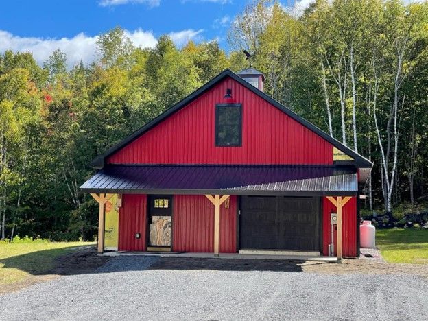 A red barn built by Juggernaut Construction Company in Vermont