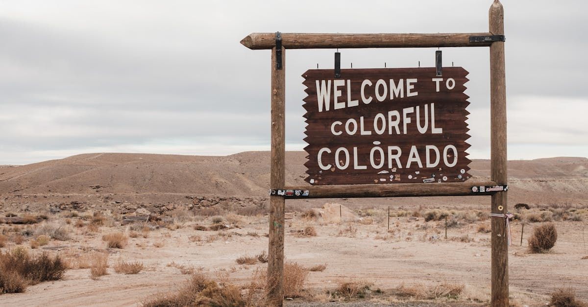 A welcome to colorful colorado sign in the desert