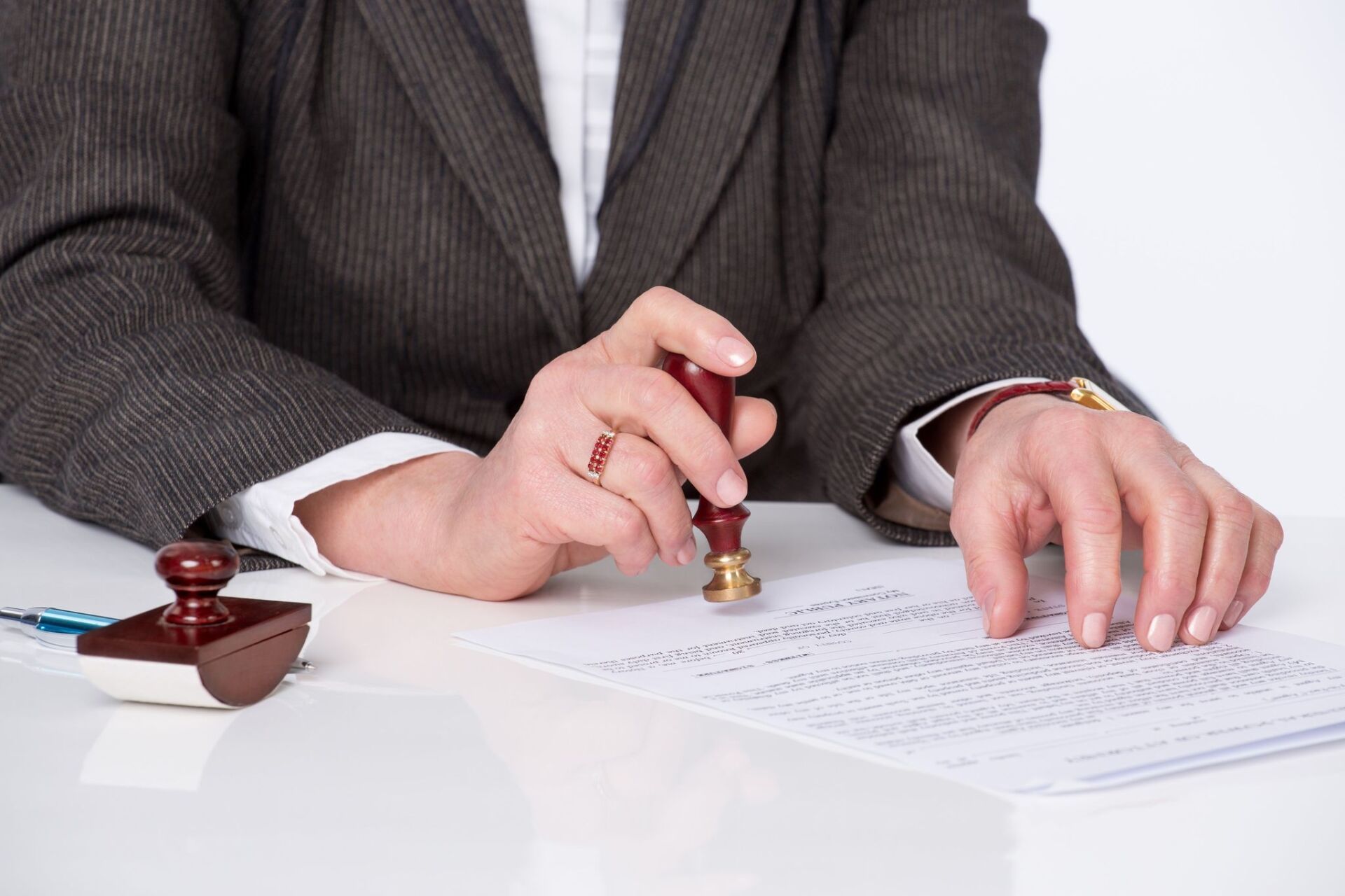 Businessman sealing a document