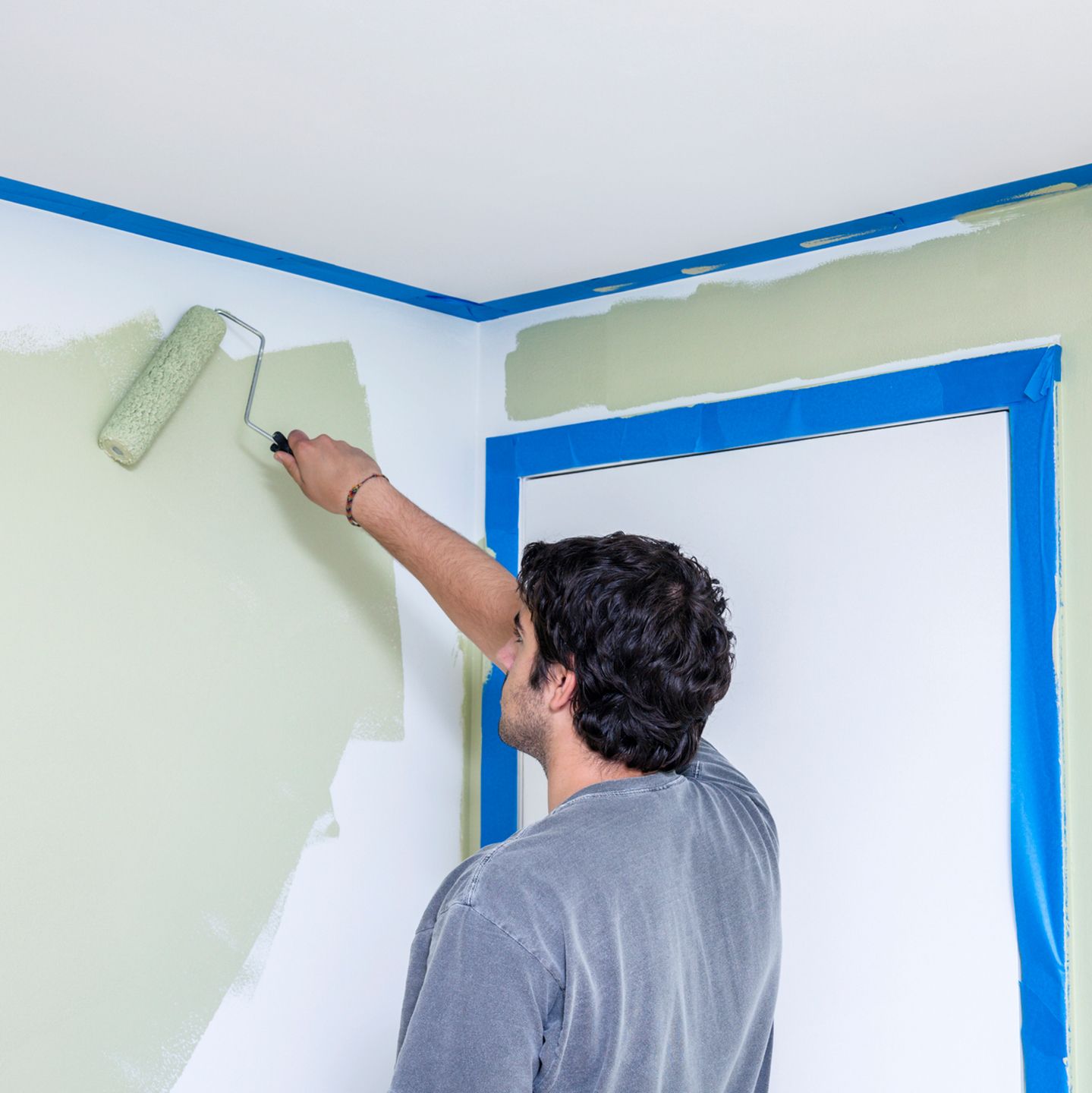 Painting Bedroom Walls With Paint Roller — Ames, IA — Winkler & Sons Inc.
