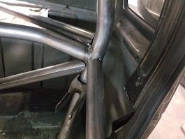 A close up of a metal frame in the back of a car.