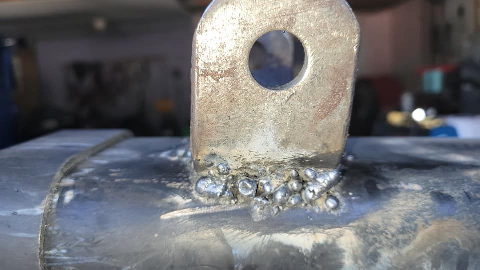 A close up of a metal object with a hole in the middle.