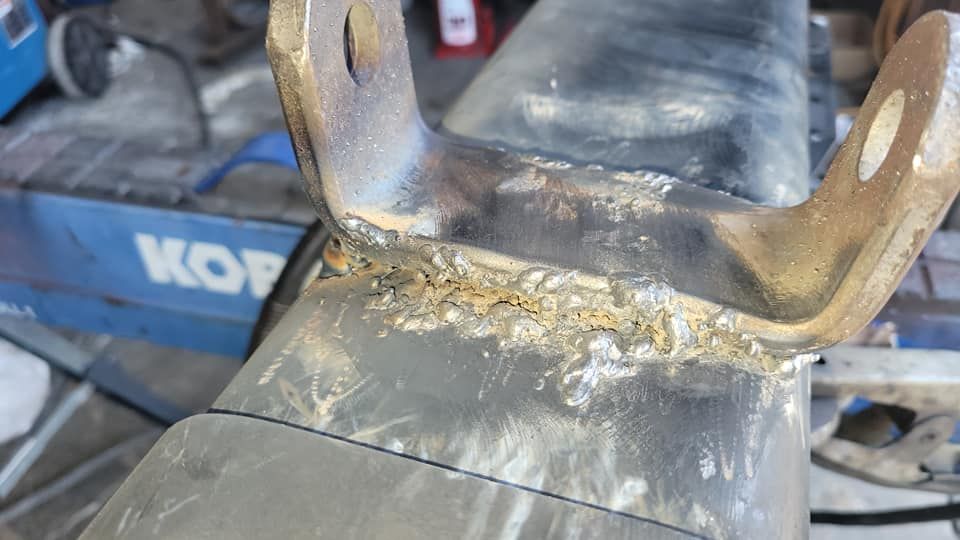 A close up of a piece of metal sitting on top of a table.