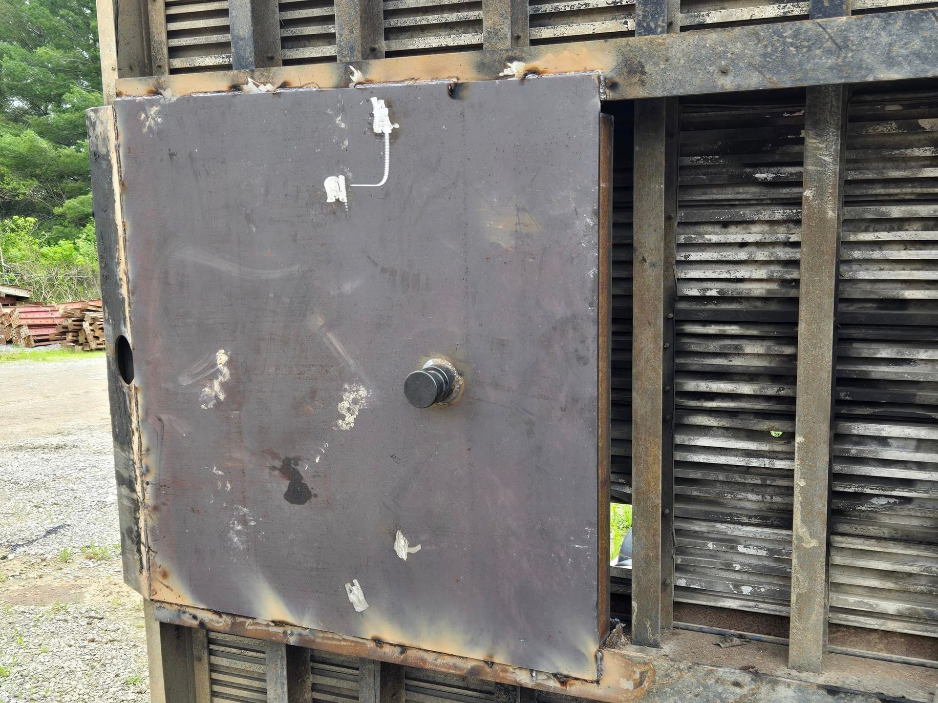 A metal door with the letter j on it