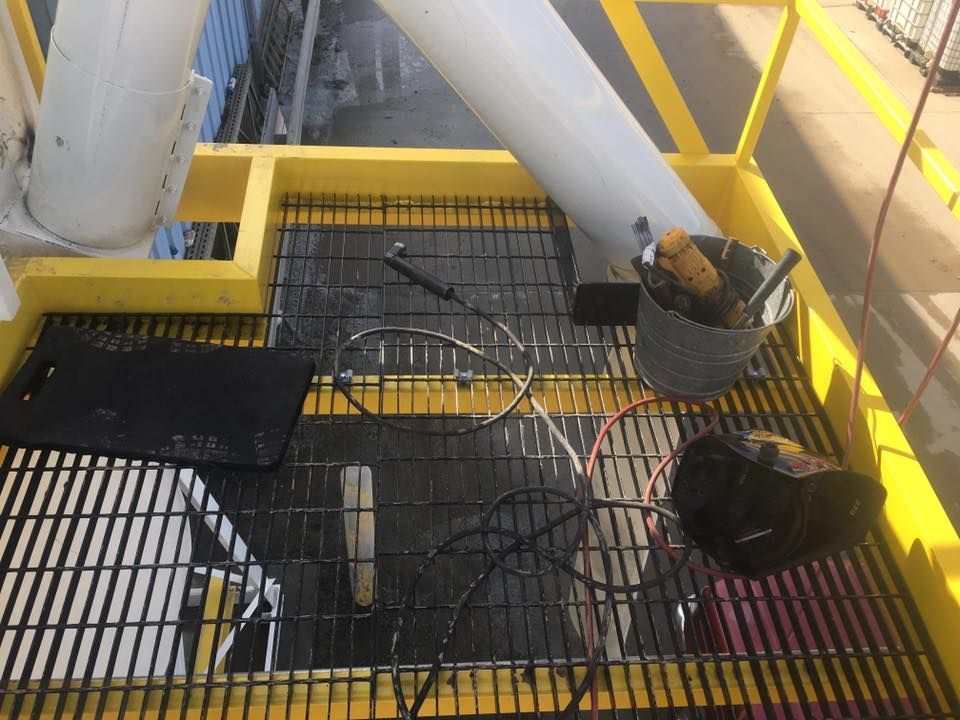 A yellow staircase with a bunch of wires on it