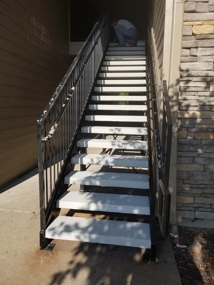 A set of stairs leading up to a building