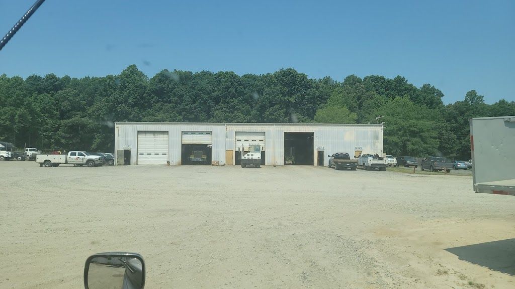 A large building with a lot of cars parked in front of it