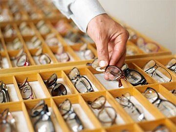Man selecting a pair of eyeglasses  - Eye care in Fayetteville, NC