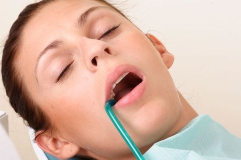 female patient under anaesthesia at dentist