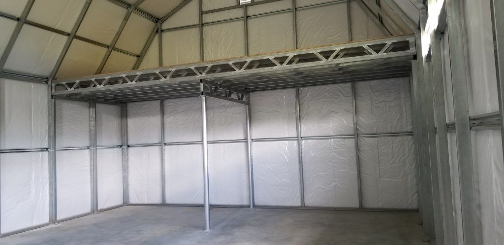 A large empty room with a metal structure and a ceiling.