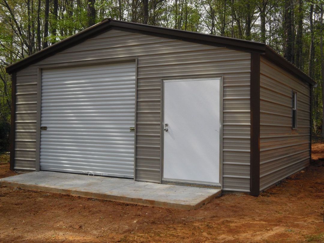A garage with a white door and a roll up garage door