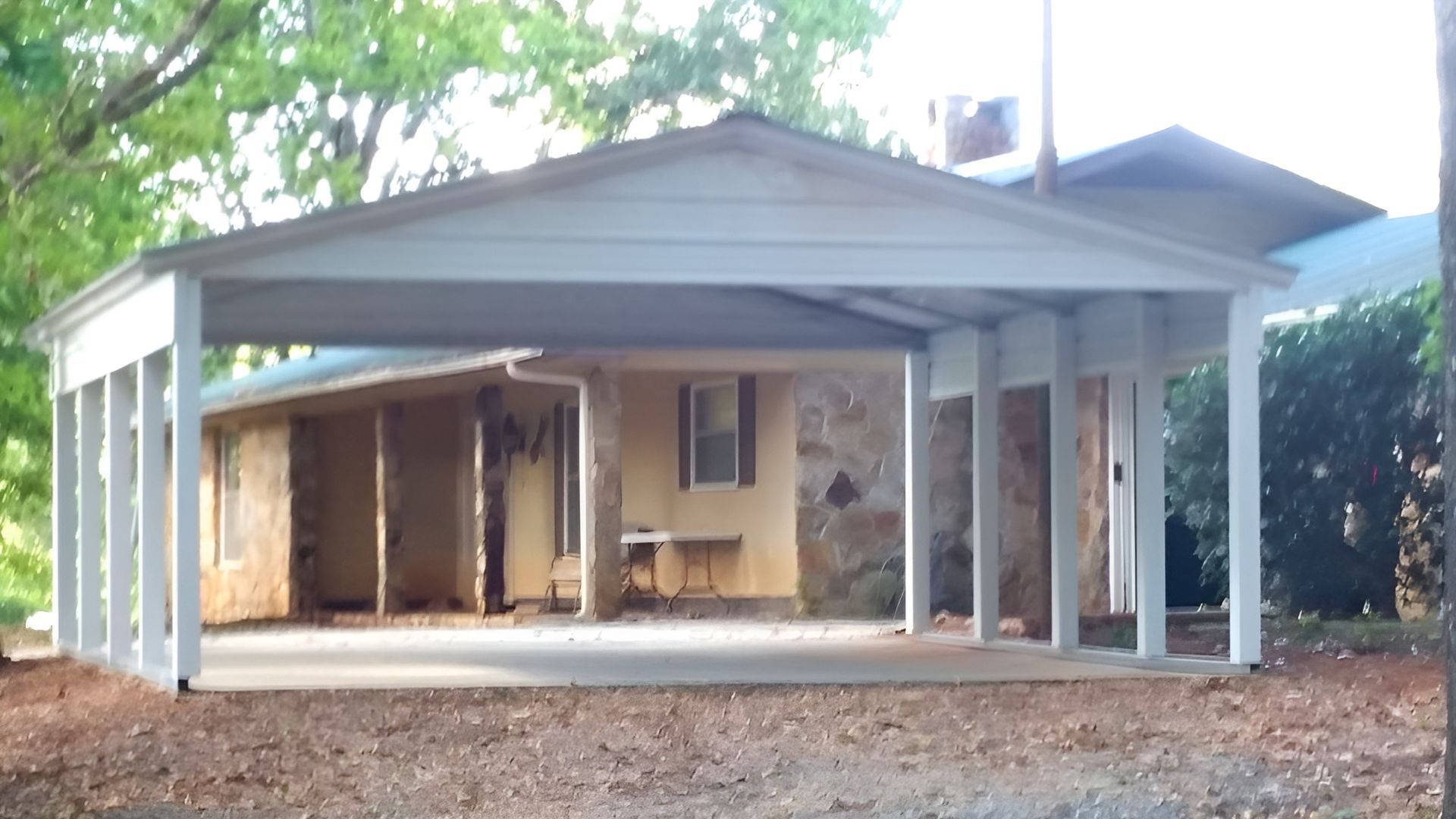A house with a carport in front of it