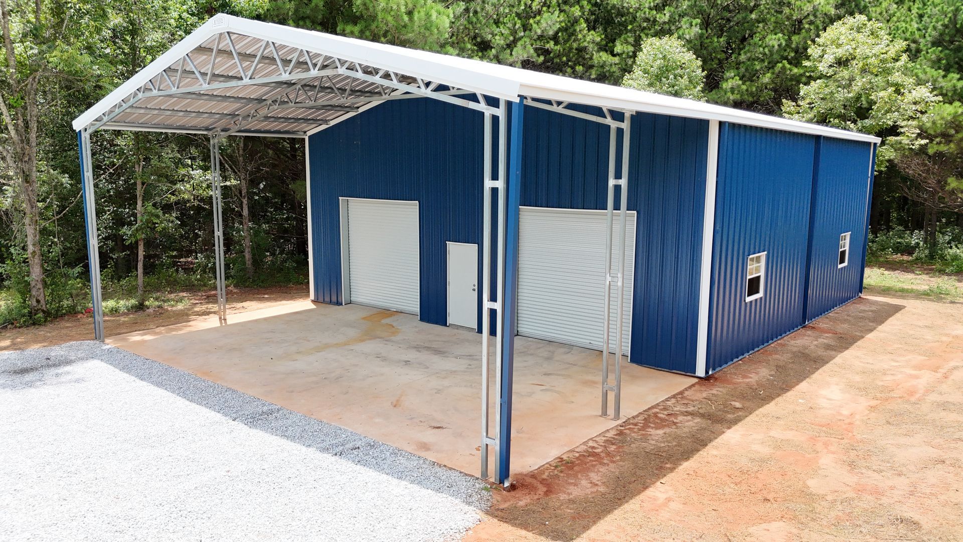 A blue metal garage with a white roof and a white door.