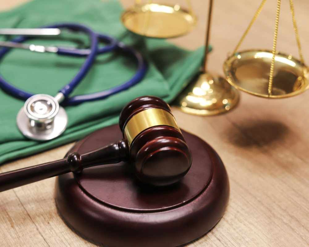 A Wooden Table Next To A Stethoscope And Scales — Kingsport, TN — Francisco & Harr