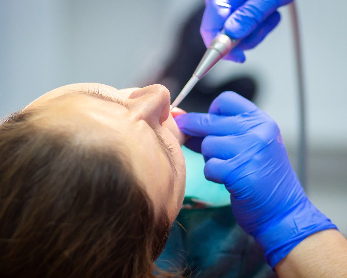 Dentist Checking Woman Teeth — Waynesboro, GA — Burke Co. Dental