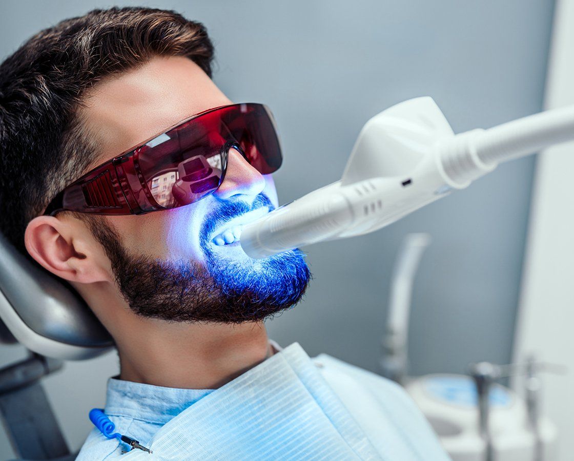 Man Having Teeth Whitening Using Laser — Waynesboro, GA — Burke Co. Dental