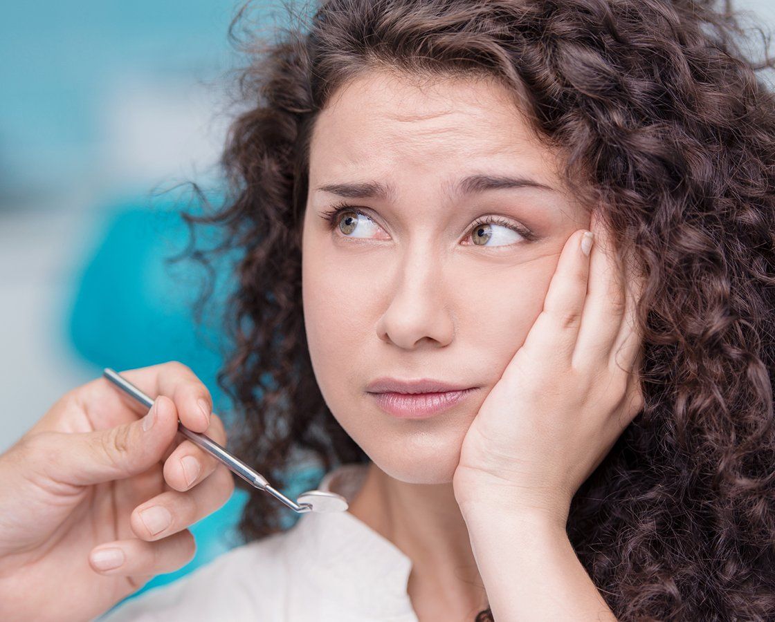 Woman Suffering From Tooth Pain — Waynesboro, GA — Burke Co. Dental