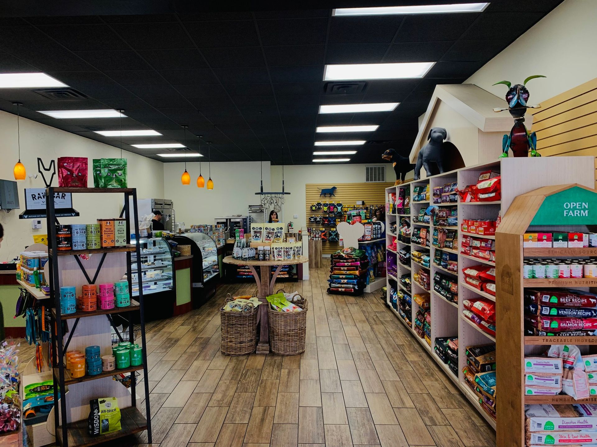 The inside of a pet store filled with lots of products.