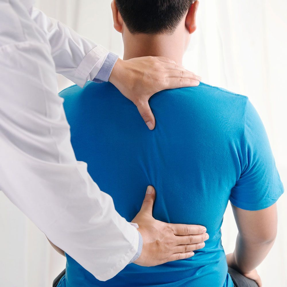 Examining Patient's Back — Charlotte, NC — Accident & Injury Center