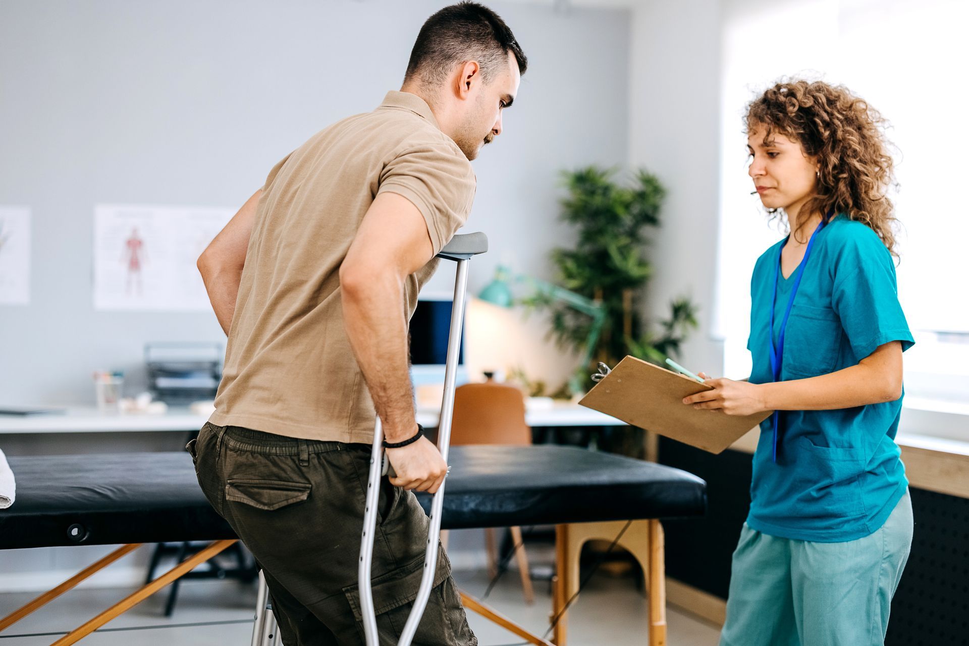 A man being examined by a physiotherapist at the clinic.