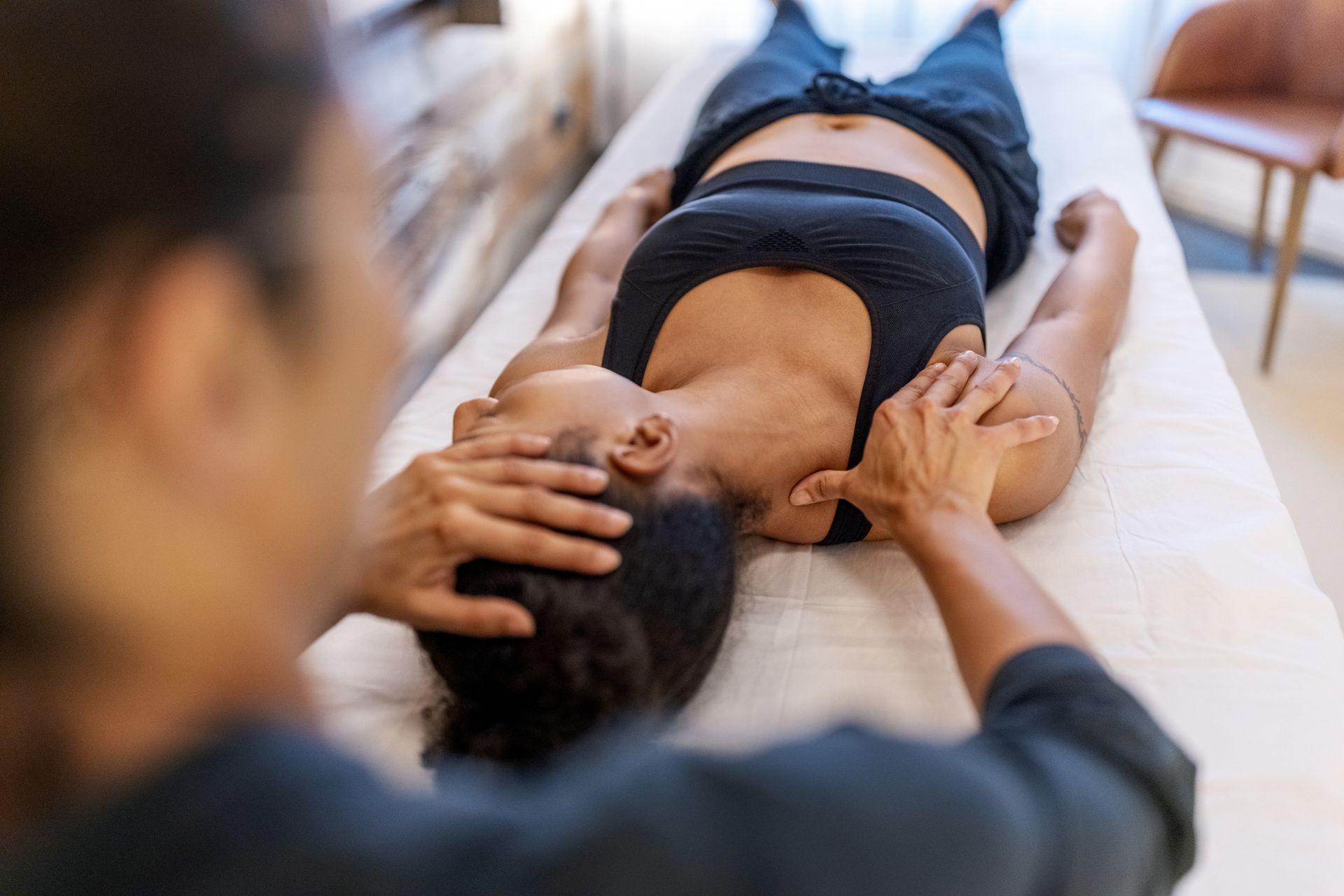A chiropractor is treating neck pain in a patient.