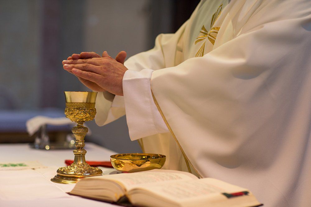Priest During Ceremony — Saint John, IN — Boric Religious Gift