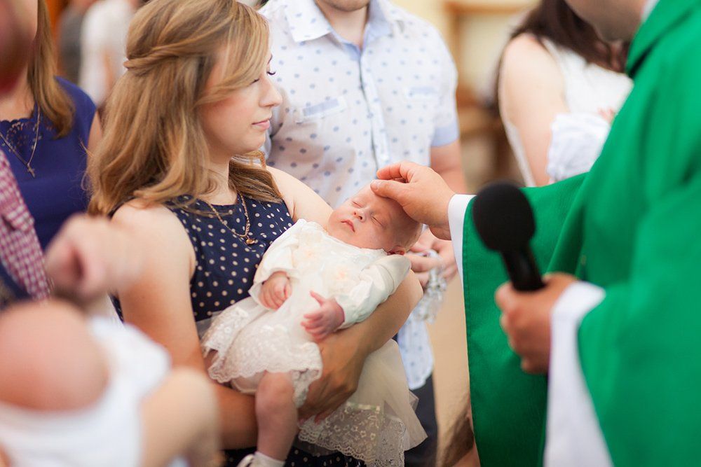 Mother Holds the Baby on Ceremony — Saint John, IN — Boric Religious Gift