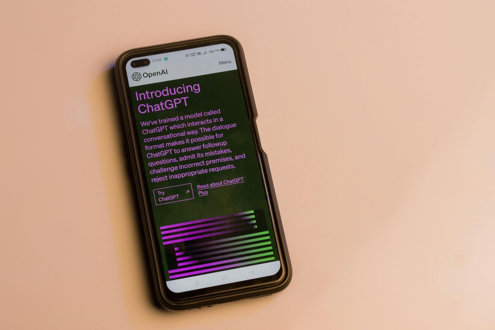 A cell phone with Chat GPT on a table.