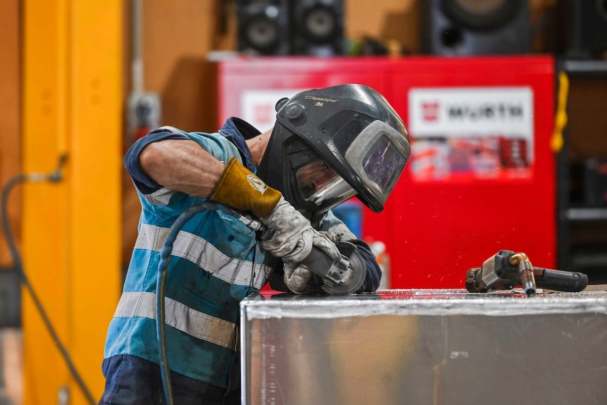 Man is Standing in Front of a Large Metal Structure in a Factory — BME NQ in Portsmith, QLD
