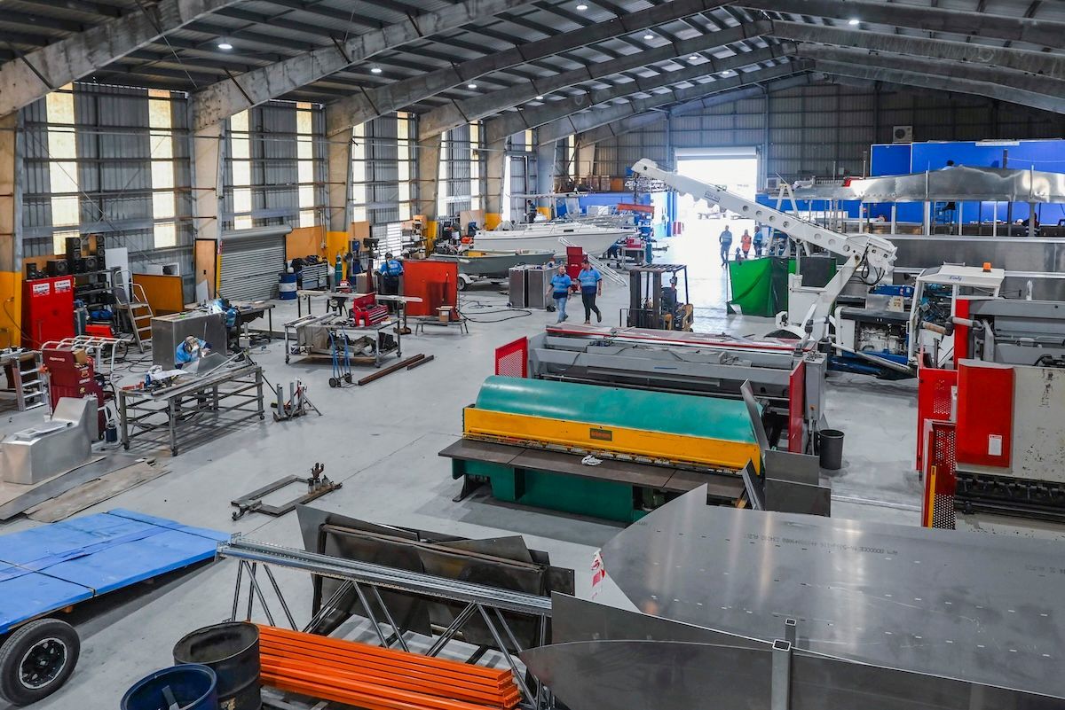 Boat is Floating on Top of a Body of Water — BME NQ in Portsmith, QLD