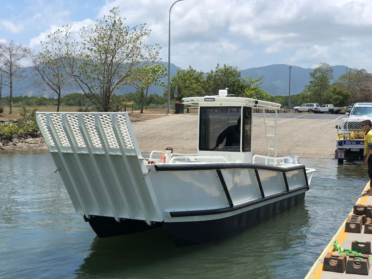 A boat is floating on top of a body of water.