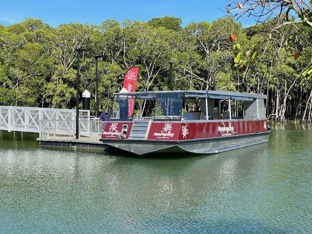A boat is docked at a dock on a lake.