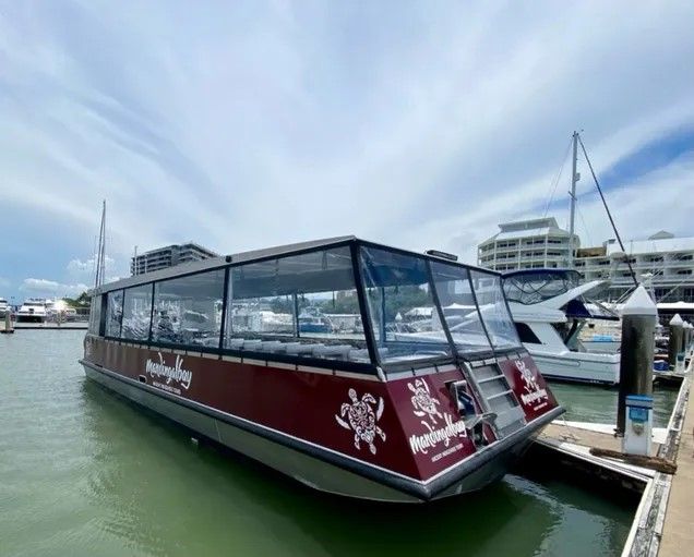 A boat is docked at a dock in the water.