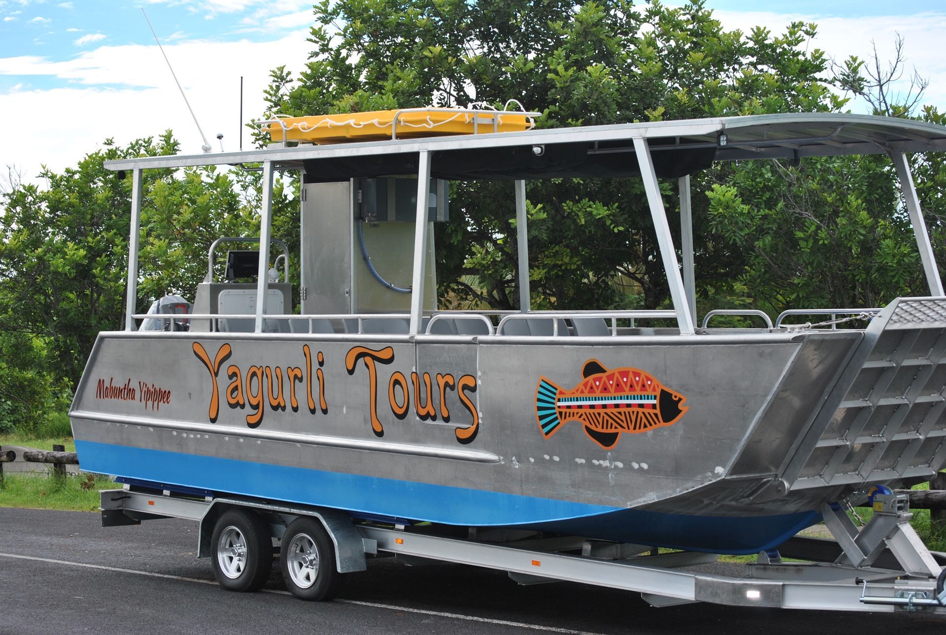 A boat on a trailer that says yaguri tours