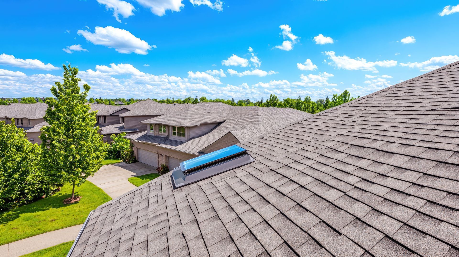 There is a skylight on the roof of a house.