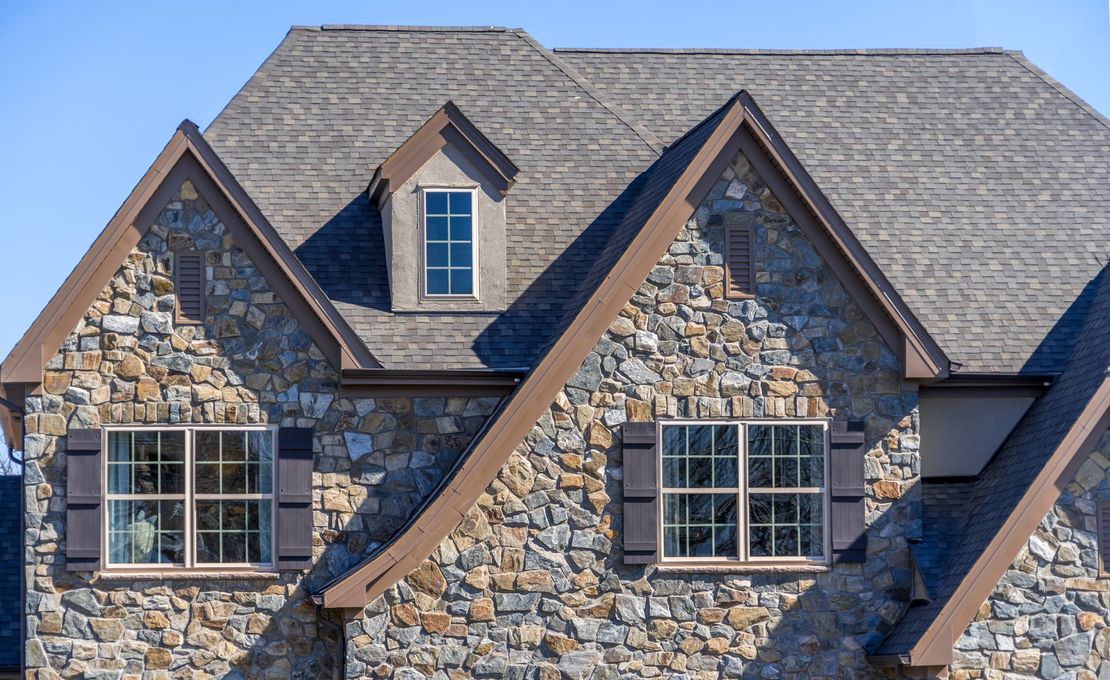 A house with a red tiled roof and a window