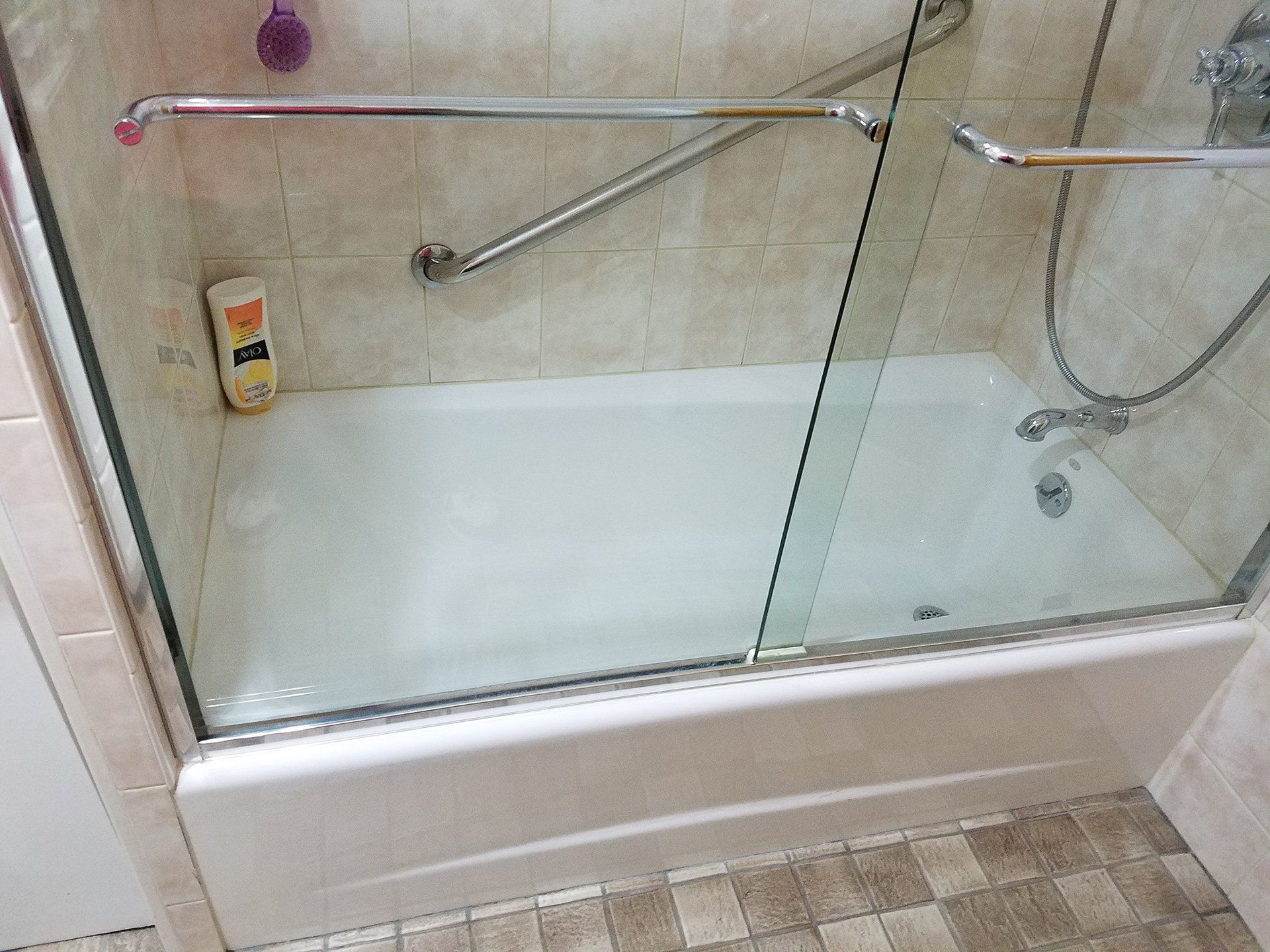 glass door attached to bathtub before