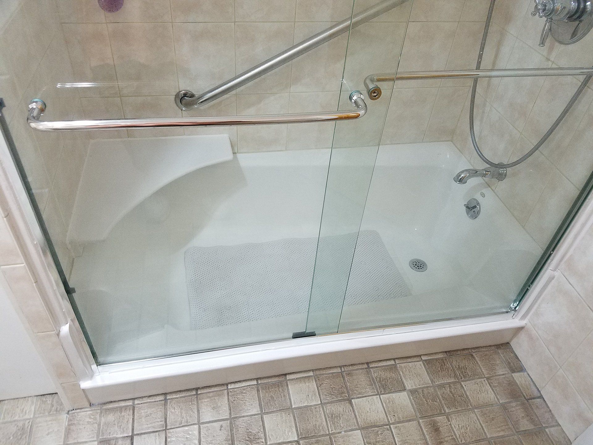 glass door attached to bathtub after remolding it