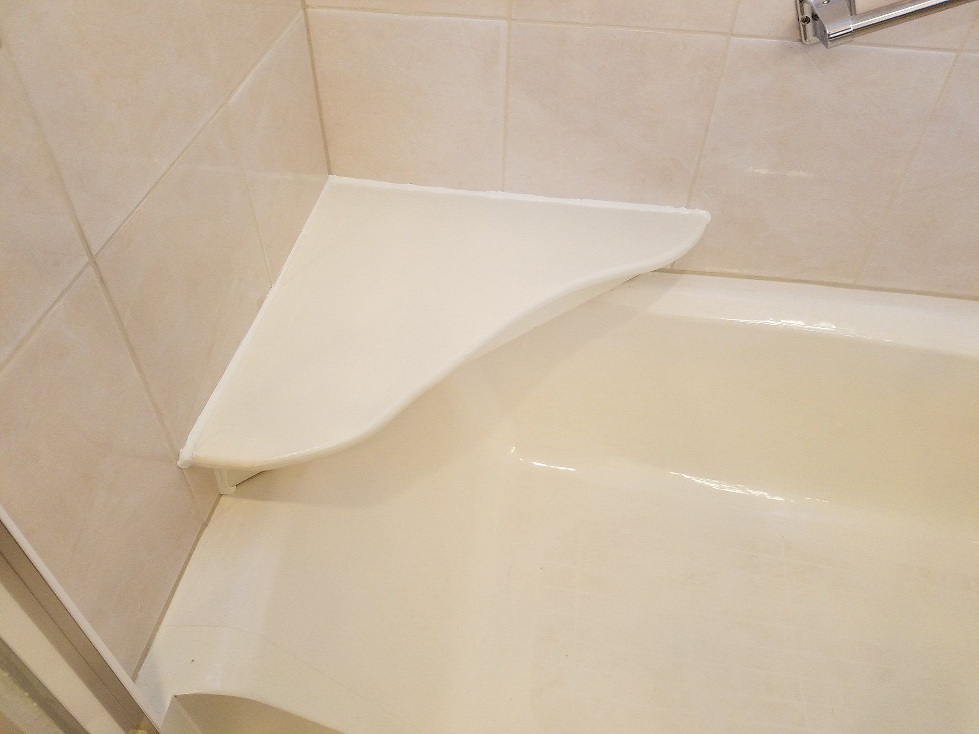 white color bath tube after with a support in the corner