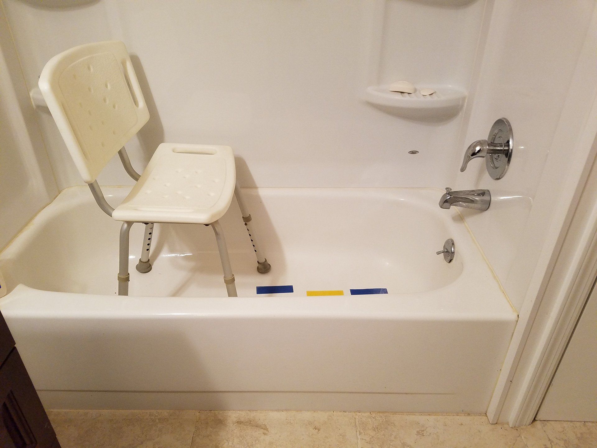 safety chair in the center of the bath tub