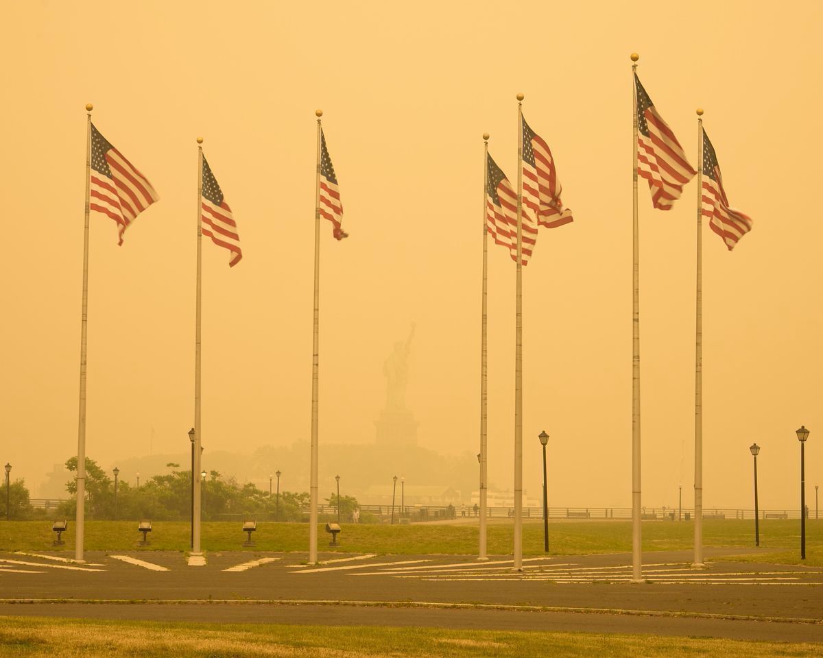American flags covered by wildfire smoke