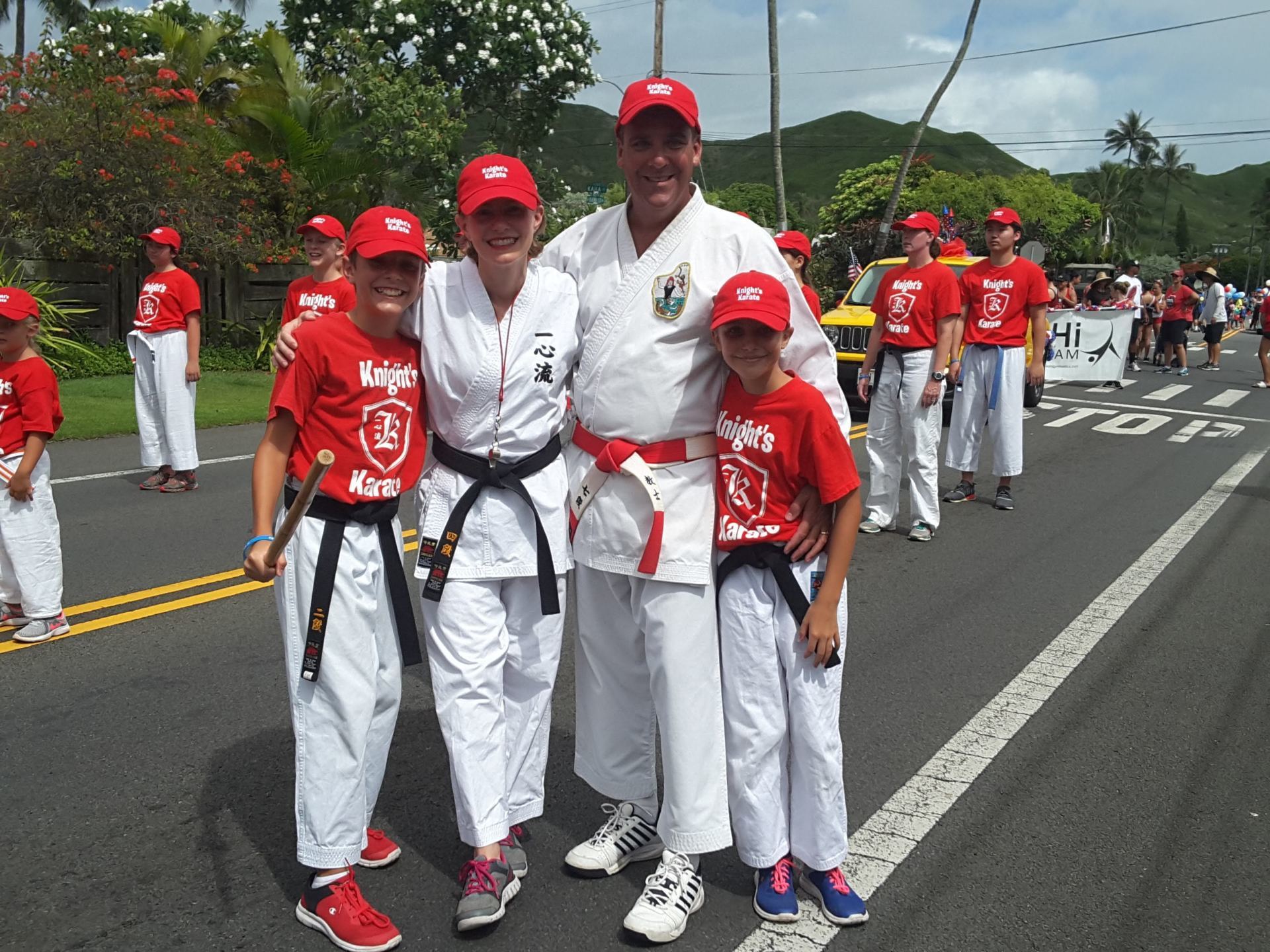 family wearing karate clothes on road
