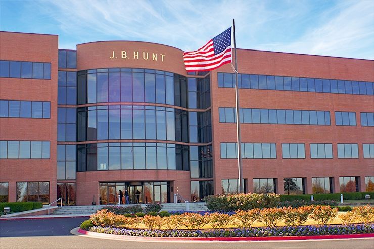 A large brick building with the name j.b. hunt on it