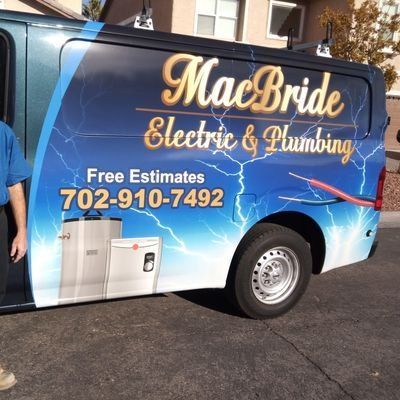A macbride electric and plumbing van is parked on the side of the road