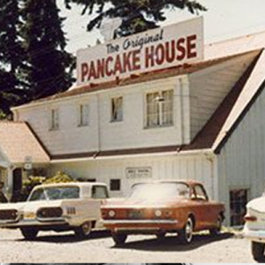 Original Pancake House restaurant exterior with vintage cars.