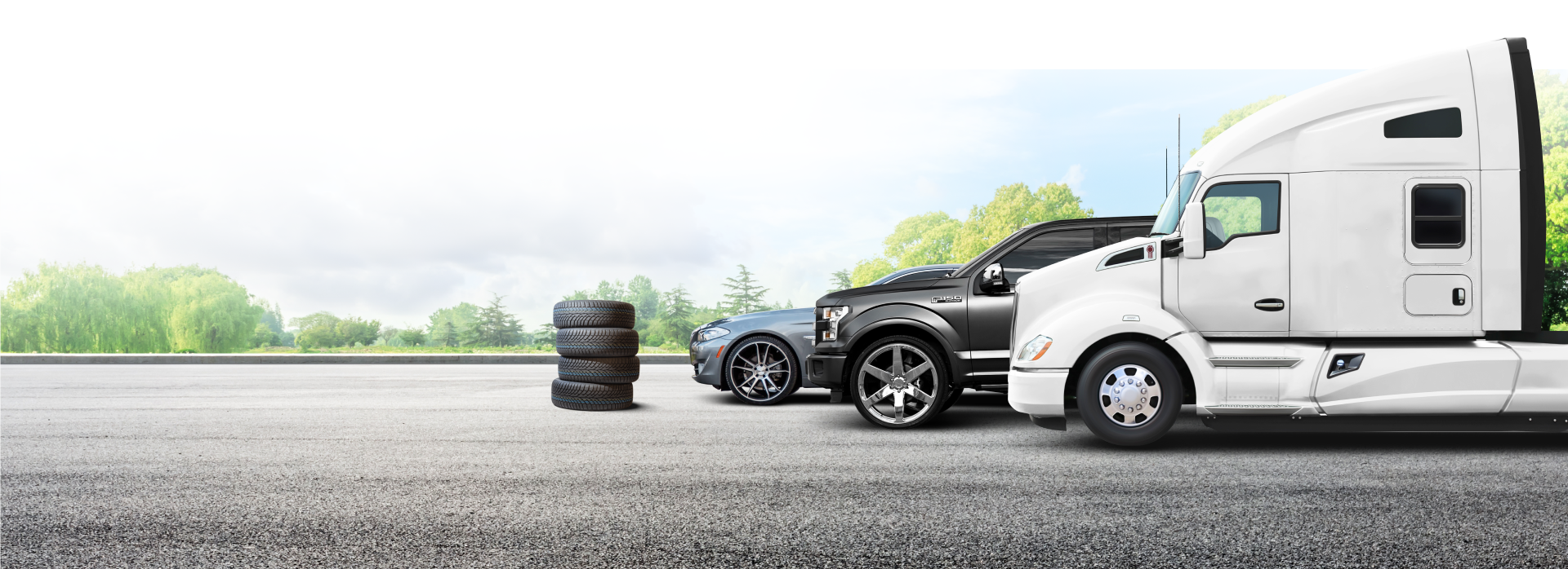 vehicles on road with tires stacked next to them | Surprise Goodyear Car Care