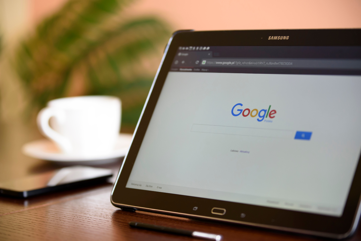 google search open on a laptop on a desk 
