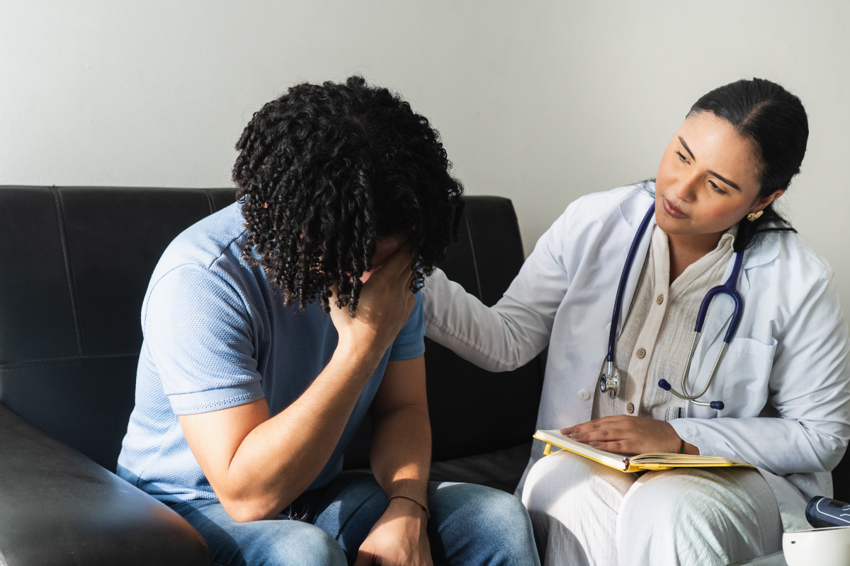 doctor consoles patient over mental health concerns 