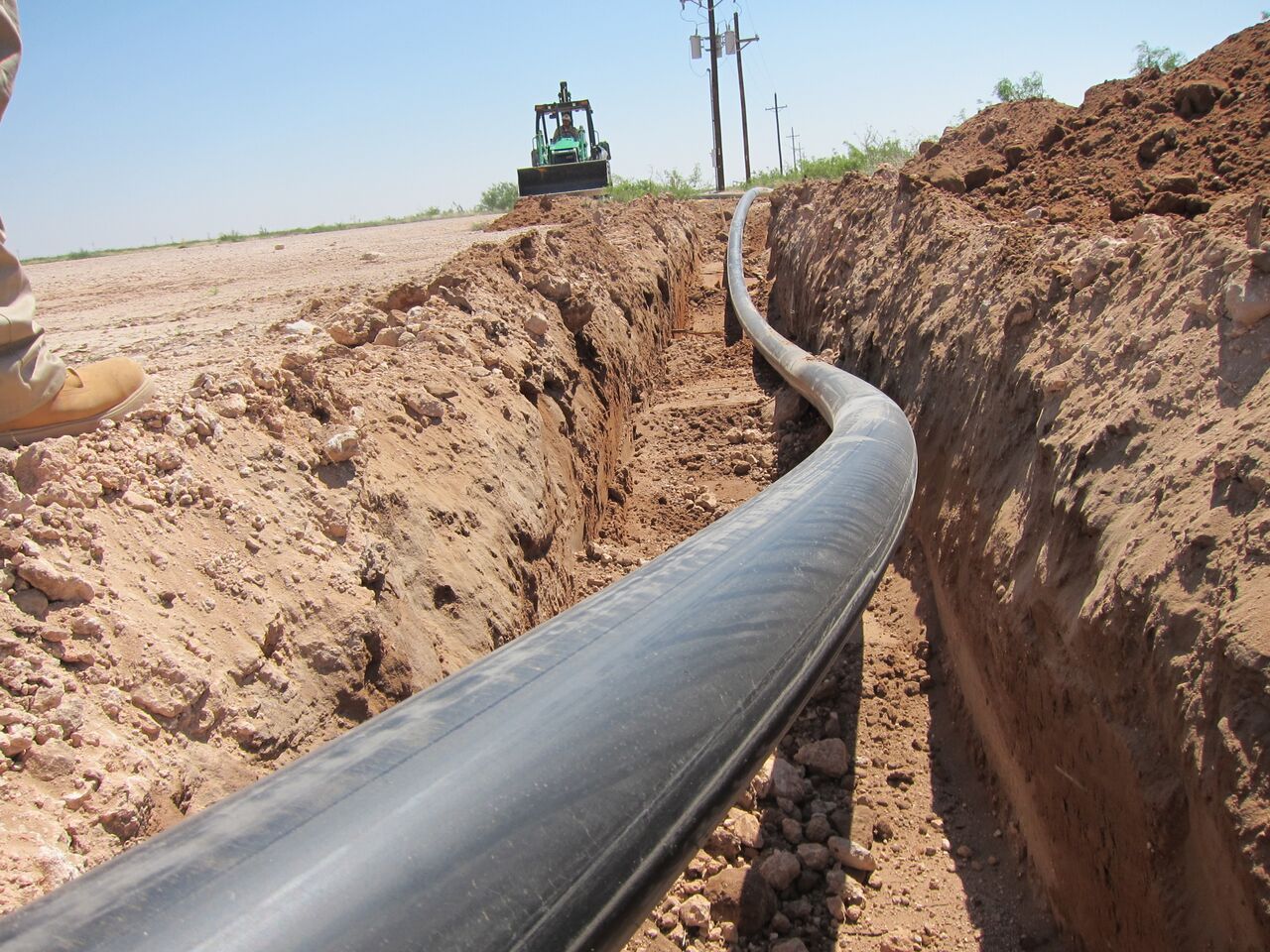 Trenching equipment and pipe in Pecos, TX